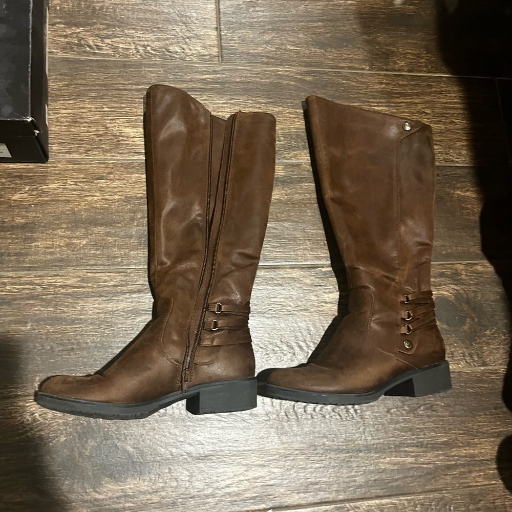 lightly worn brown boots